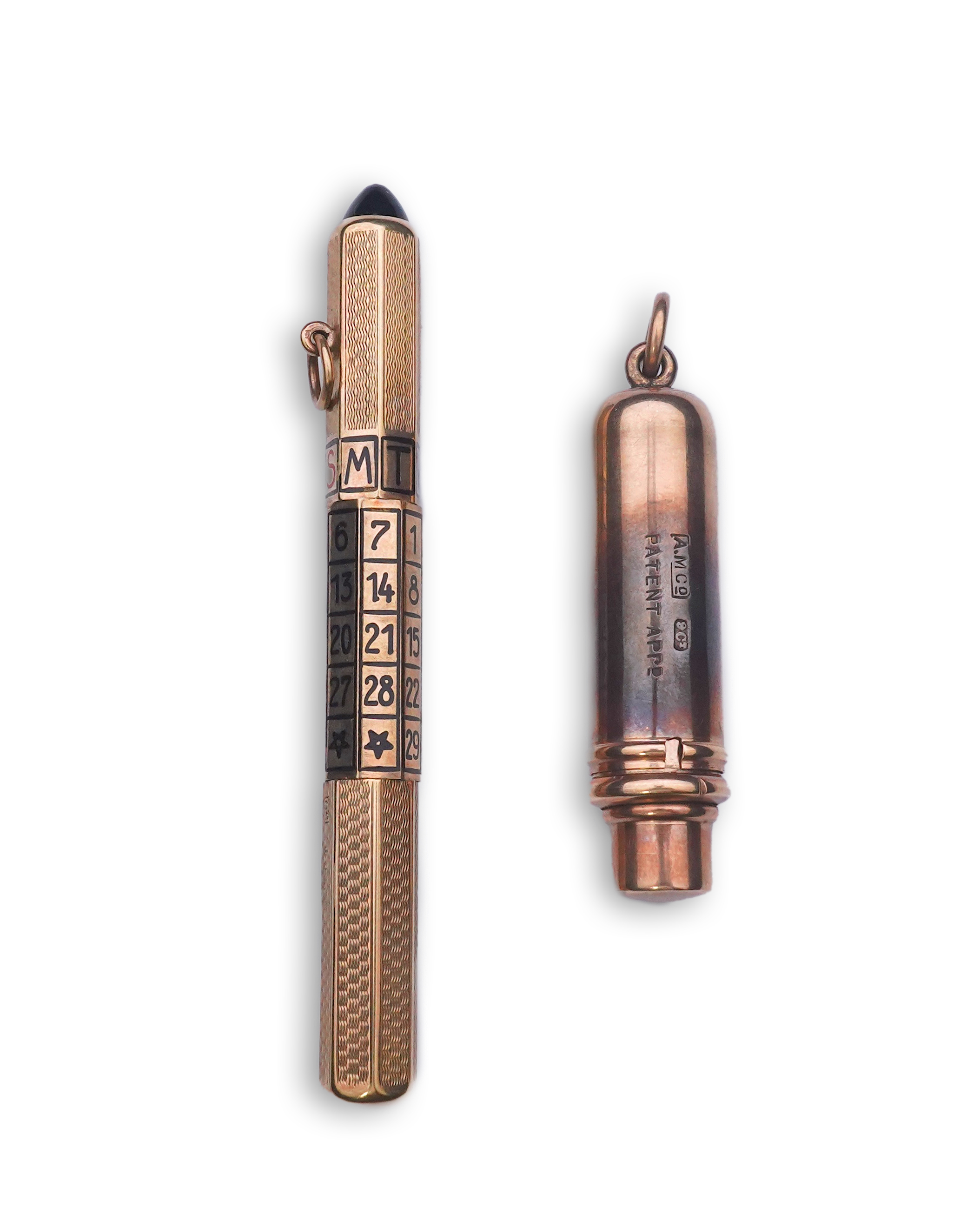 A gold calendar pencil and a gold pocket stamp dispenser